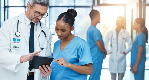 Doctor, woman nurse and healthcare team consulting medical treatment or insurance in hospital. Seni